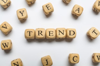 Image of Word Trend made of wooden cubes with letters on white background, top view