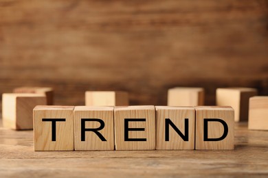 Image of Word Trend made of wooden cubes with letters on table