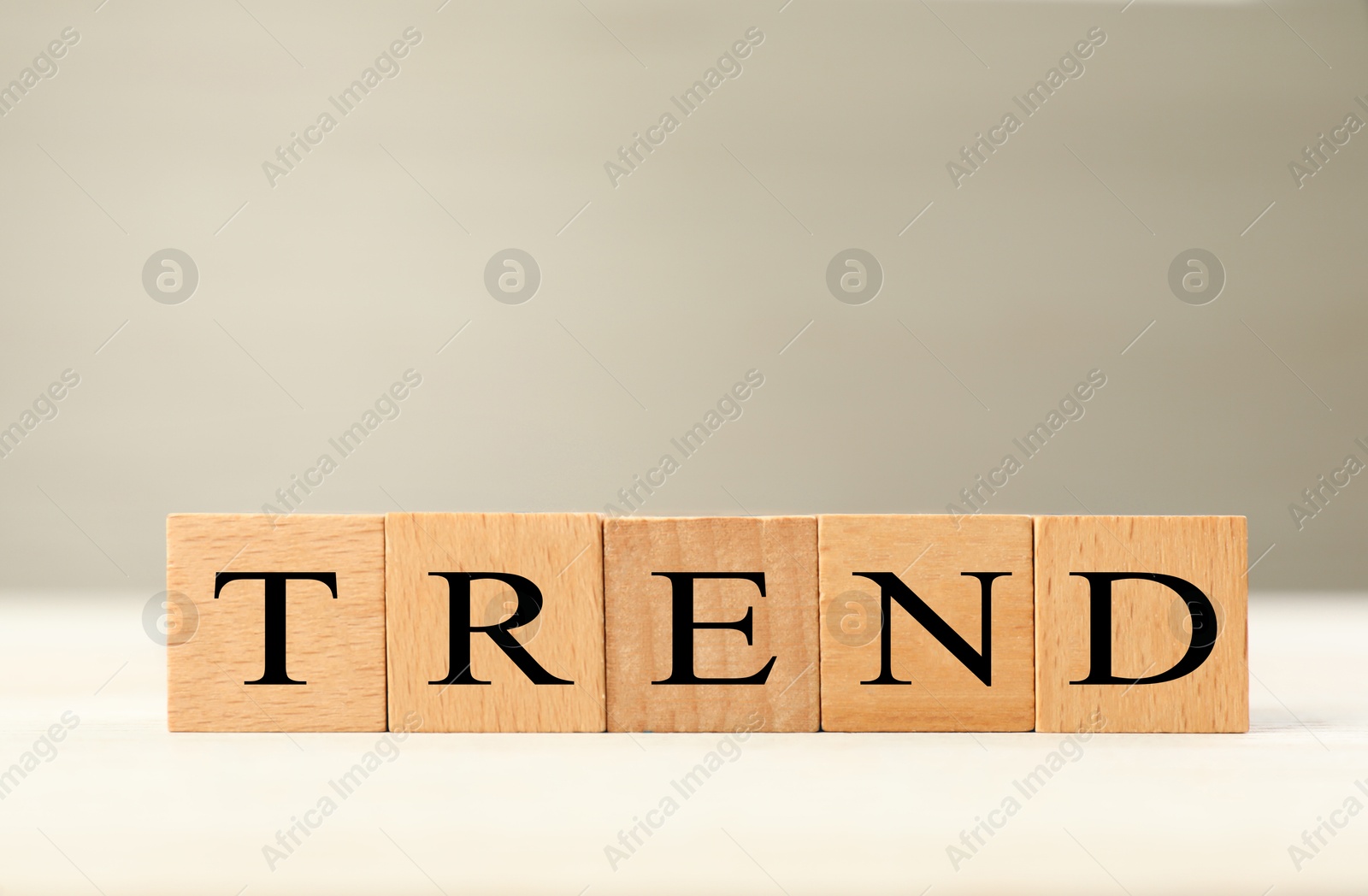 Word Trend made of wooden cubes with letters on table Image of Word Trend made of wooden cubes with letters on table