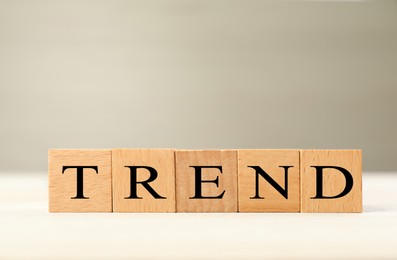 Image of Word Trend made of wooden cubes with letters on table