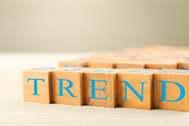 Image of Word Trend made of wooden cubes with letters on table