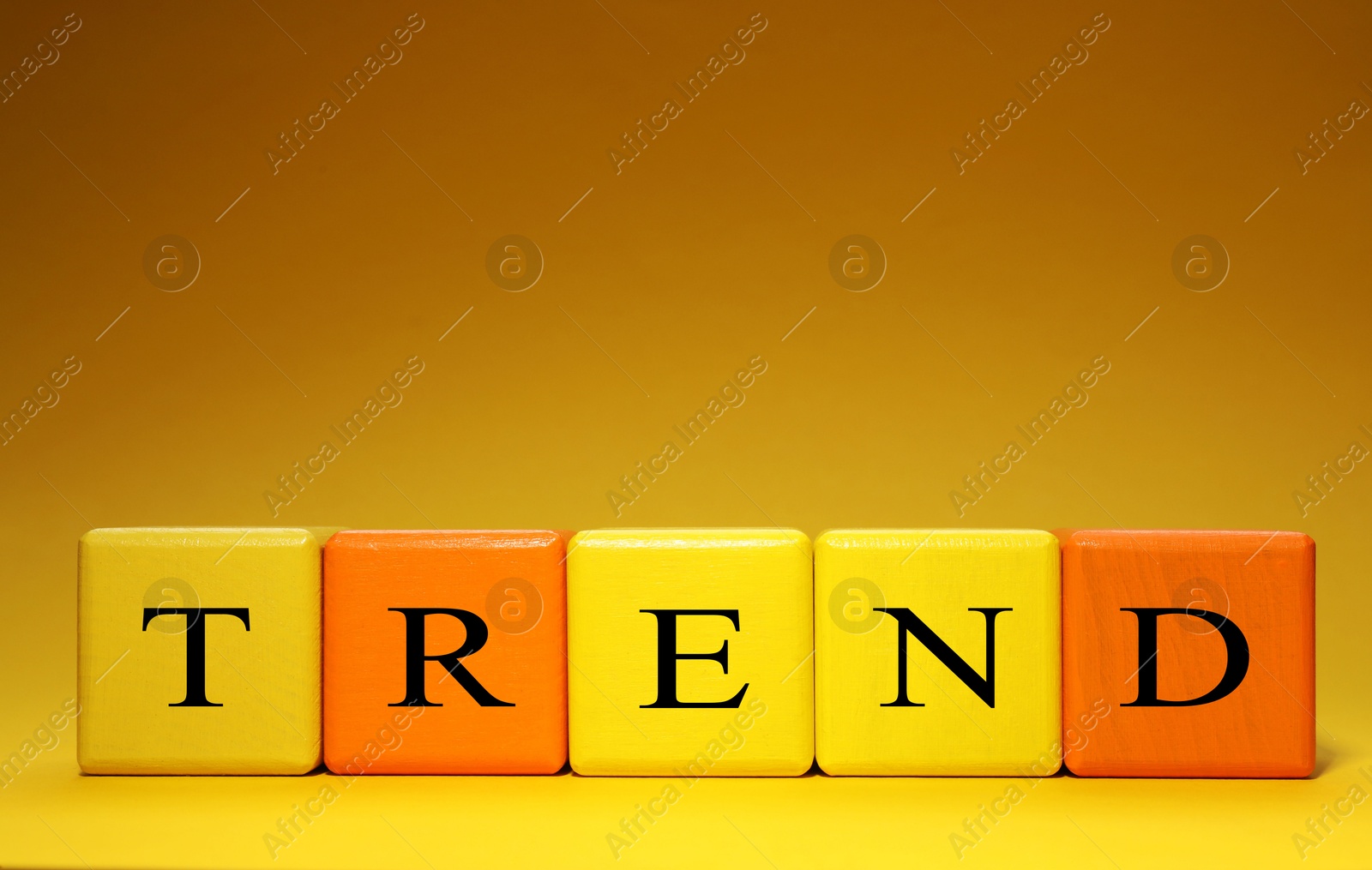 Word Trend made of colorful cubes with letters on yellow gradient background Image of Word Trend made of colorful cubes with letters on yellow gradient background