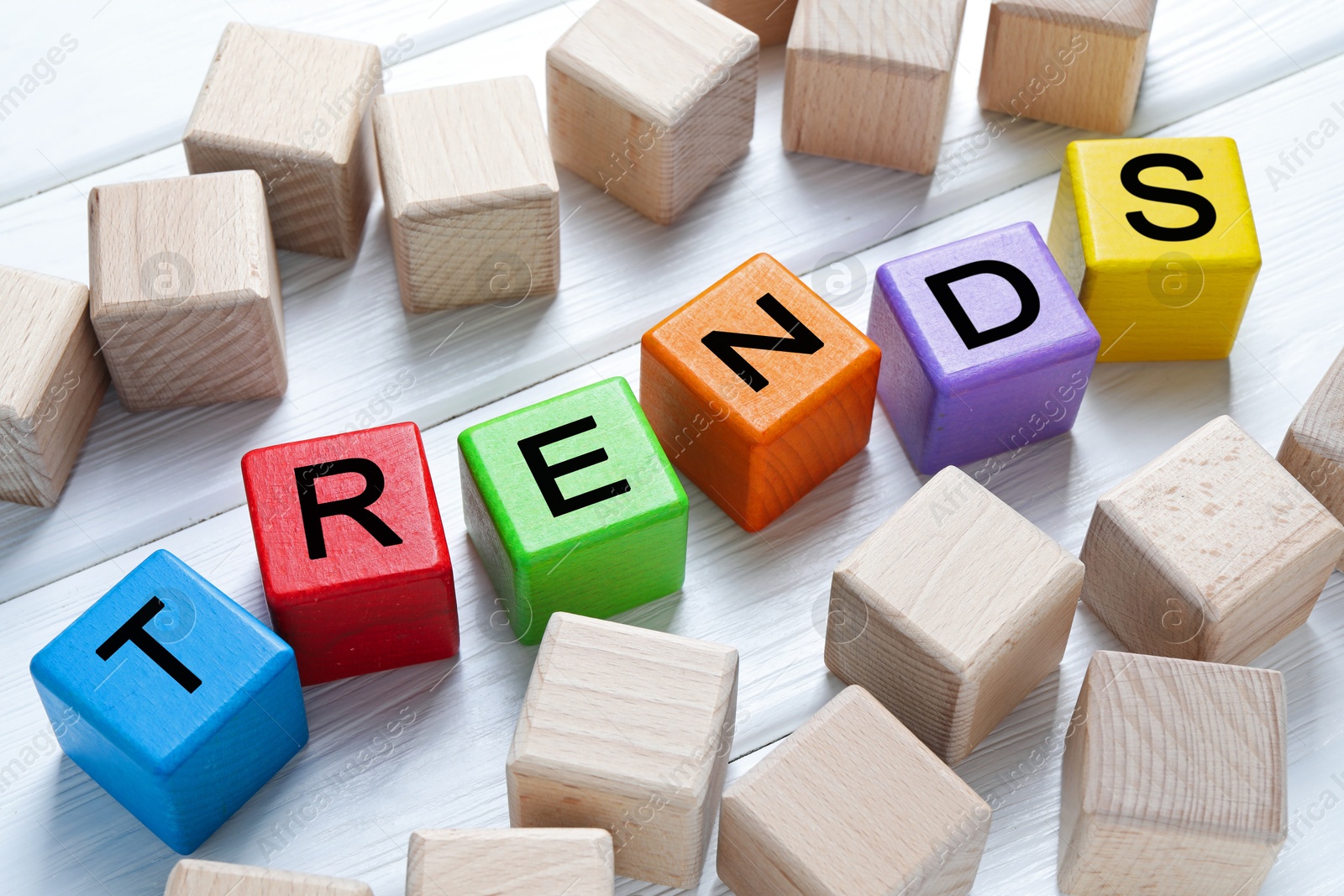 Word Trends made of colorful cubes with letters on table Image of Word Trends made of colorful cubes with letters on table