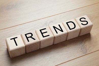 Image of Word Trends made of wooden cubes with letters on table