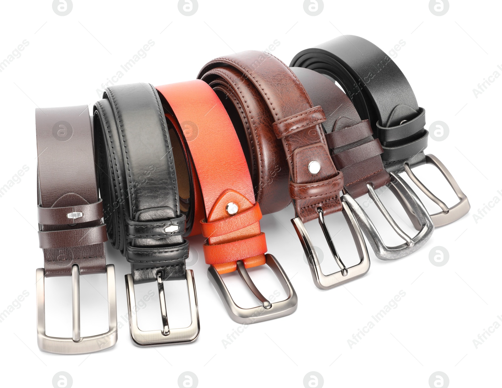 Many different leather belts isolated on white Photo of Many different leather belts isolated on white
