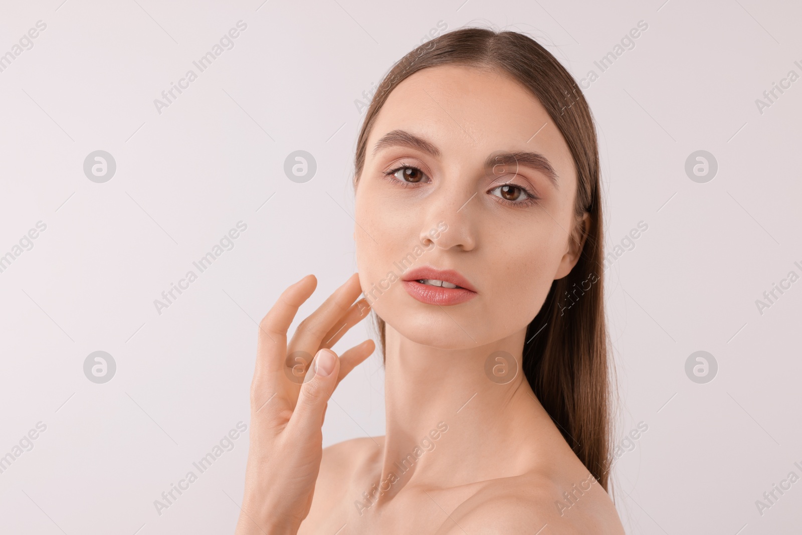 Portrait of attractive young woman on white background Photo of Portrait of attractive young woman on white background
