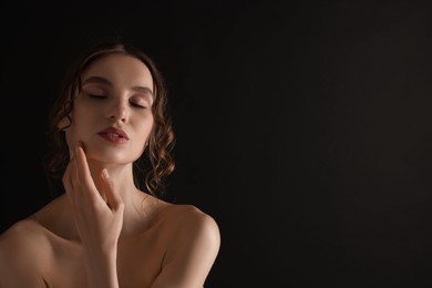 Photo of Portrait of gorgeous young woman on black background. Space for text