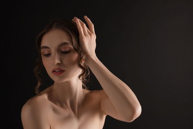 Photo of Portrait of gorgeous young woman on black background. Space for text