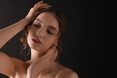 Photo of Portrait of gorgeous young woman on black background. Space for text