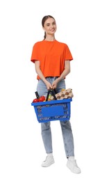 Photo of Woman with shopping basket full of products on white background