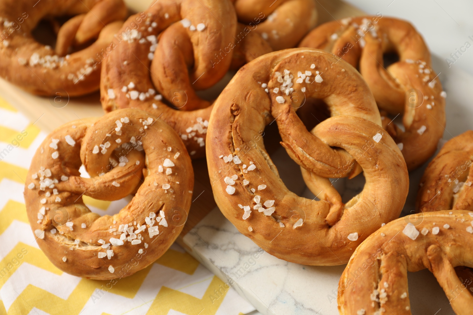 Tasty pretzels with salt on table, above view Photo of Tasty pretzels with salt on table, above view