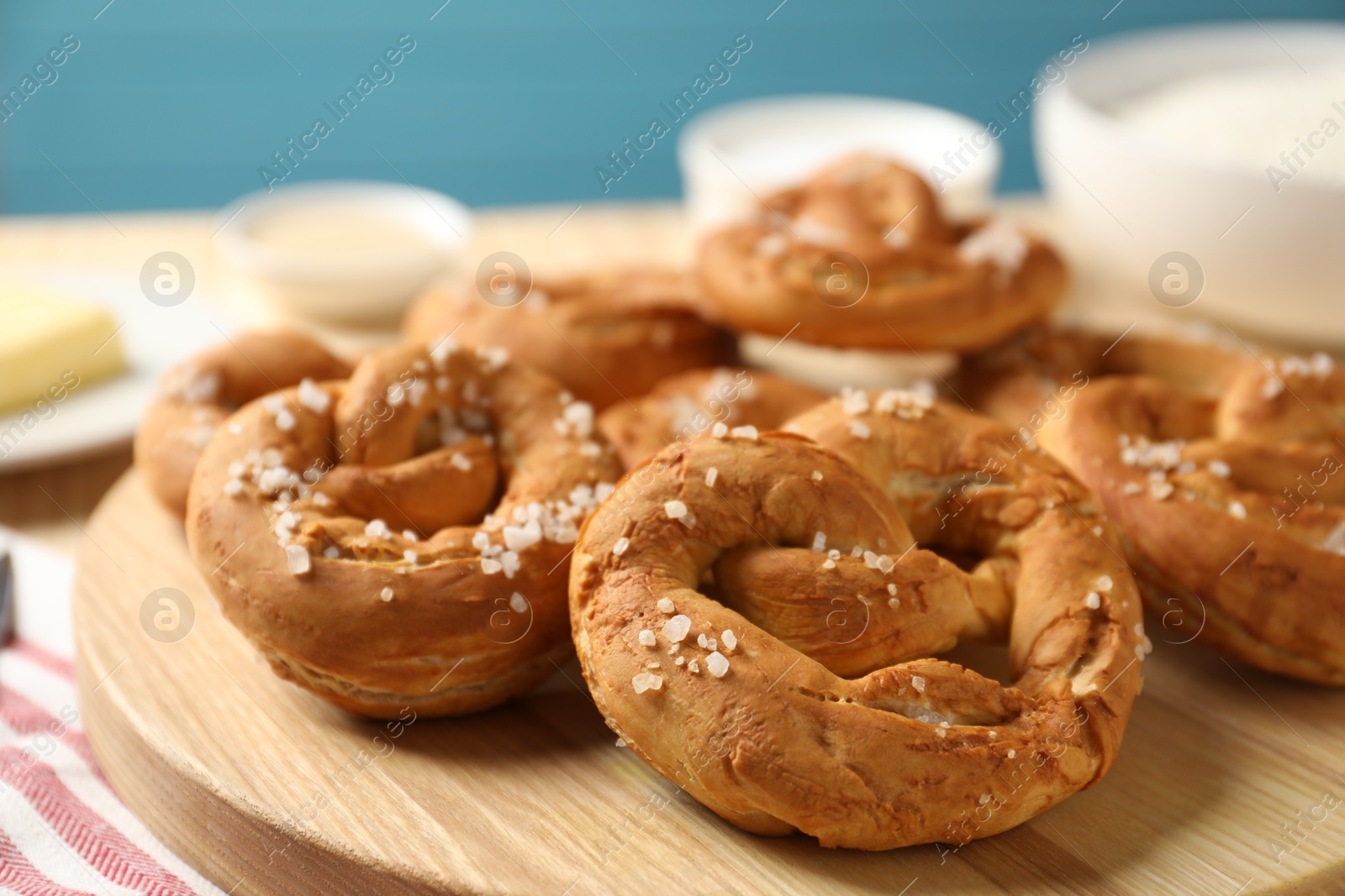 Tasty pretzels with salt on table, closeup Photo of Tasty pretzels with salt on table, closeup