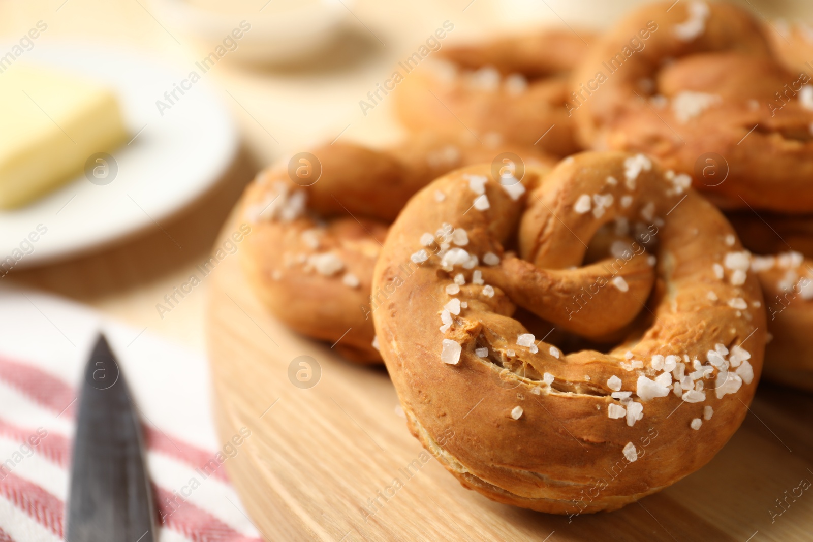 Tasty pretzels with salt on table, closeup Photo of Tasty pretzels with salt on table, closeup