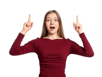 Photo of Excited teenage girl pointing at something on white background
