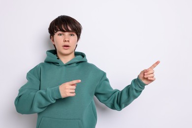 Photo of Portrait of teenage boy on white background