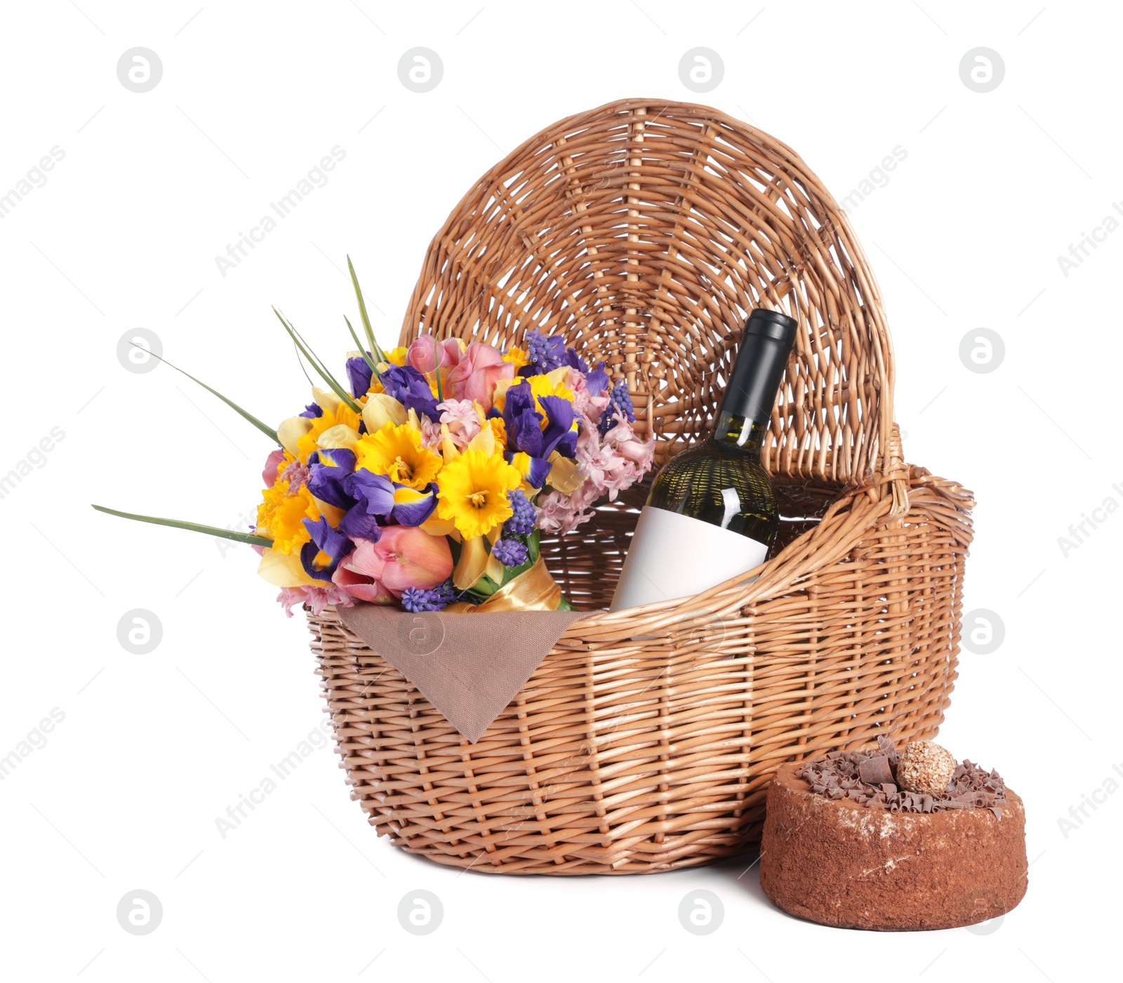 Picnic wicker basket with beautiful flowers, bottle of wine and cake isolated on white Photo of Picnic wicker basket with beautiful flowers, bottle of wine and cake isolated on white