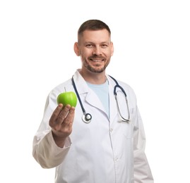 Photo of Nutritionist with green apple and stethoscope on white background