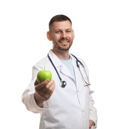 Photo of Nutritionist with green apple and stethoscope on white background