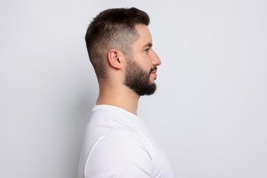 Photo of Man after scoliosis treatment on light background