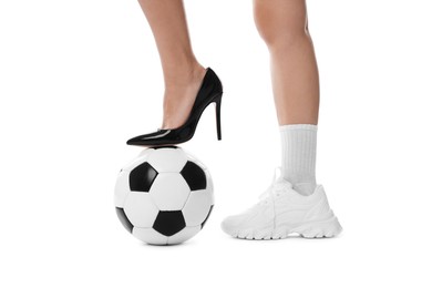 Photo of Woman in high heeled shoe and sneaker with soccer ball on white background, closeup
