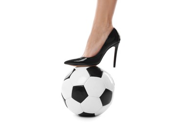 Photo of Woman in high heeled shoe with soccer ball on white background, closeup