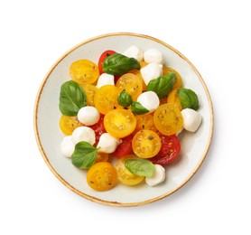 Photo of Fresh salad with yellow tomatoes, basil and mozzarella cheese isolated on white, top view