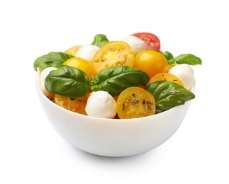 Photo of Fresh salad with yellow tomatoes, basil and mozzarella cheese in bowl isolated on white
