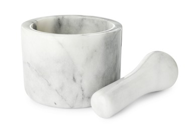 Photo of Marble mortar with pestle isolated on white