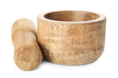Photo of Wooden mortar with pestle isolated on white