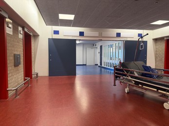 Photo of Stretcher inside modern hospital hall. Medical equipment