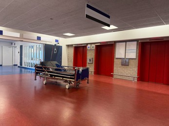 Photo of Stretcher inside modern hospital hall. Medical equipment