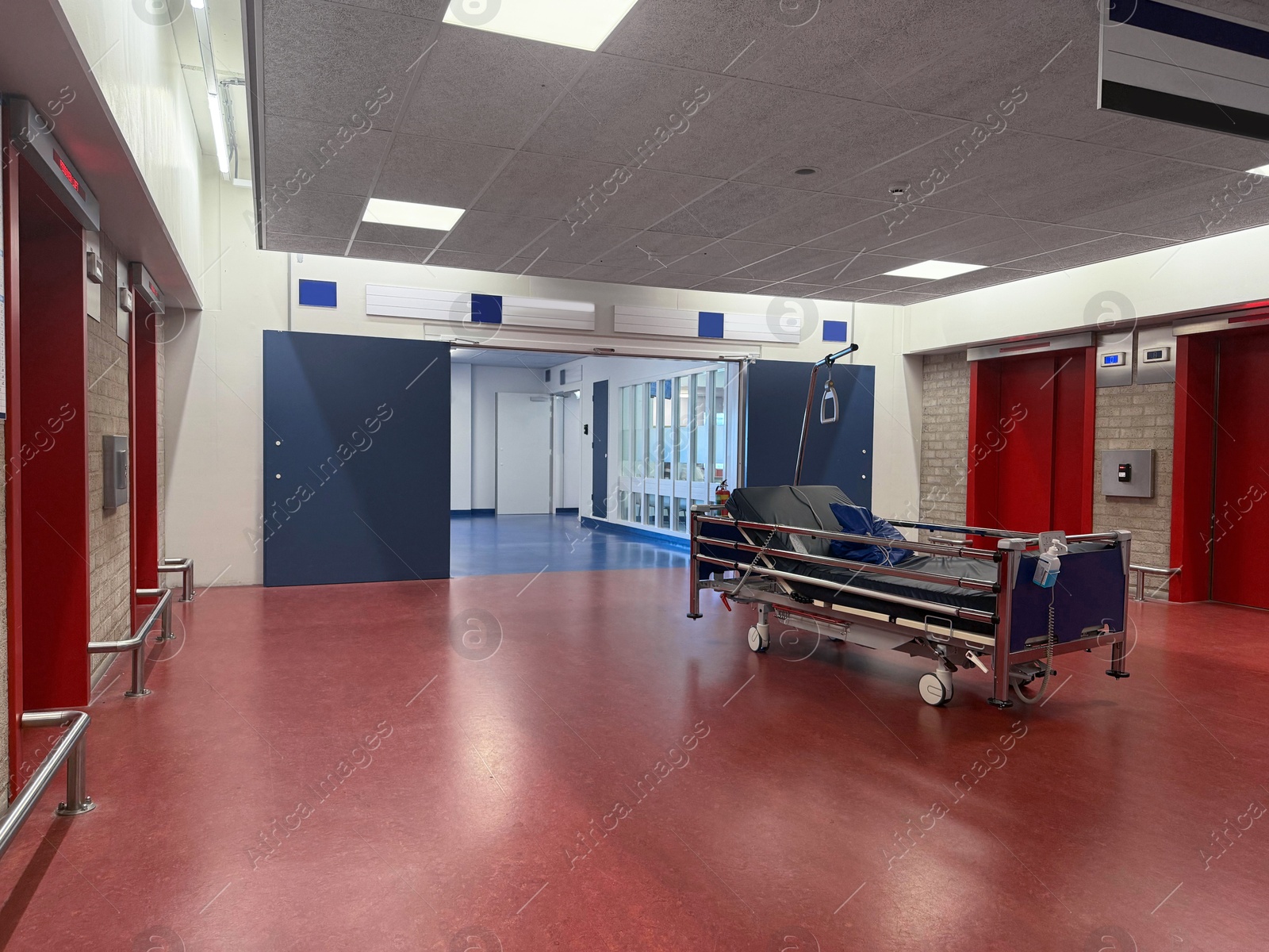 Stretcher inside modern hospital hall. Medical equipment Photo of Stretcher inside modern hospital hall. Medical equipment