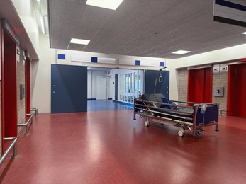 Photo of Stretcher inside modern hospital hall. Medical equipment