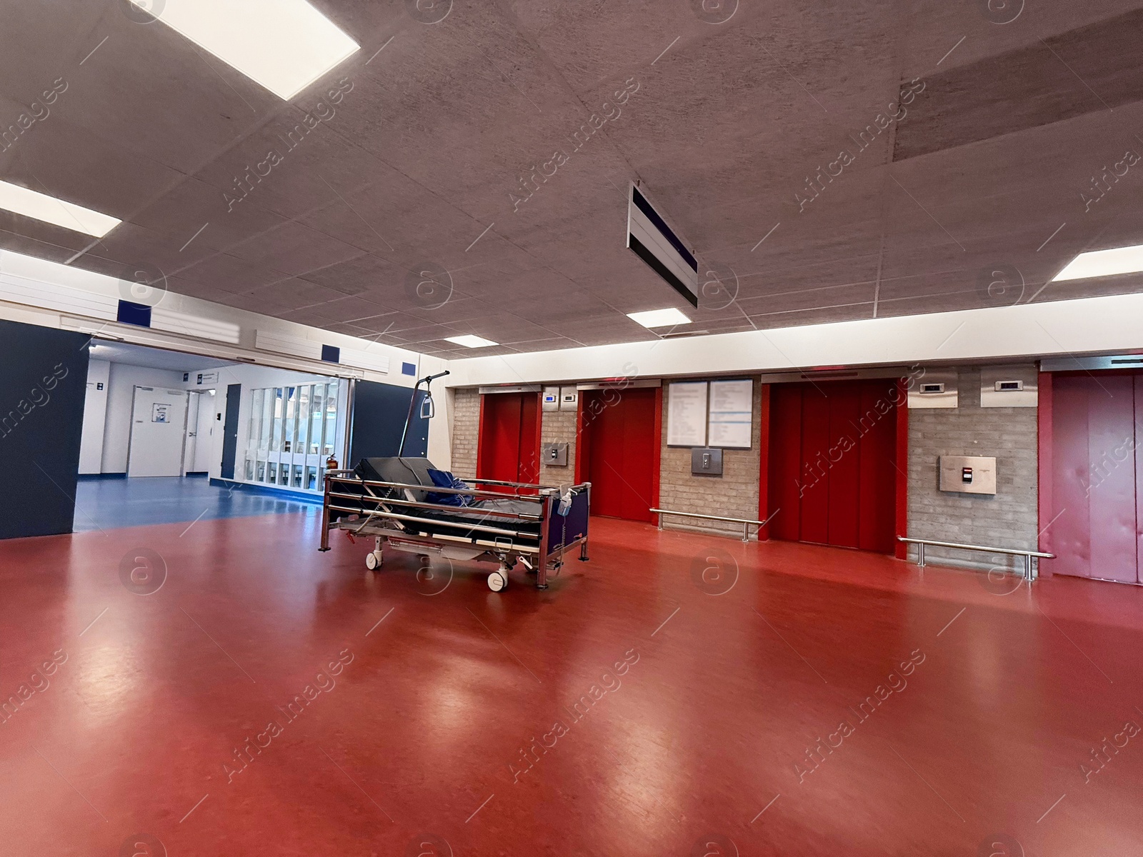 Stretcher inside modern hospital hall. Medical equipment Photo of Stretcher inside modern hospital hall. Medical equipment