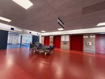Photo of Stretcher inside modern hospital hall. Medical equipment