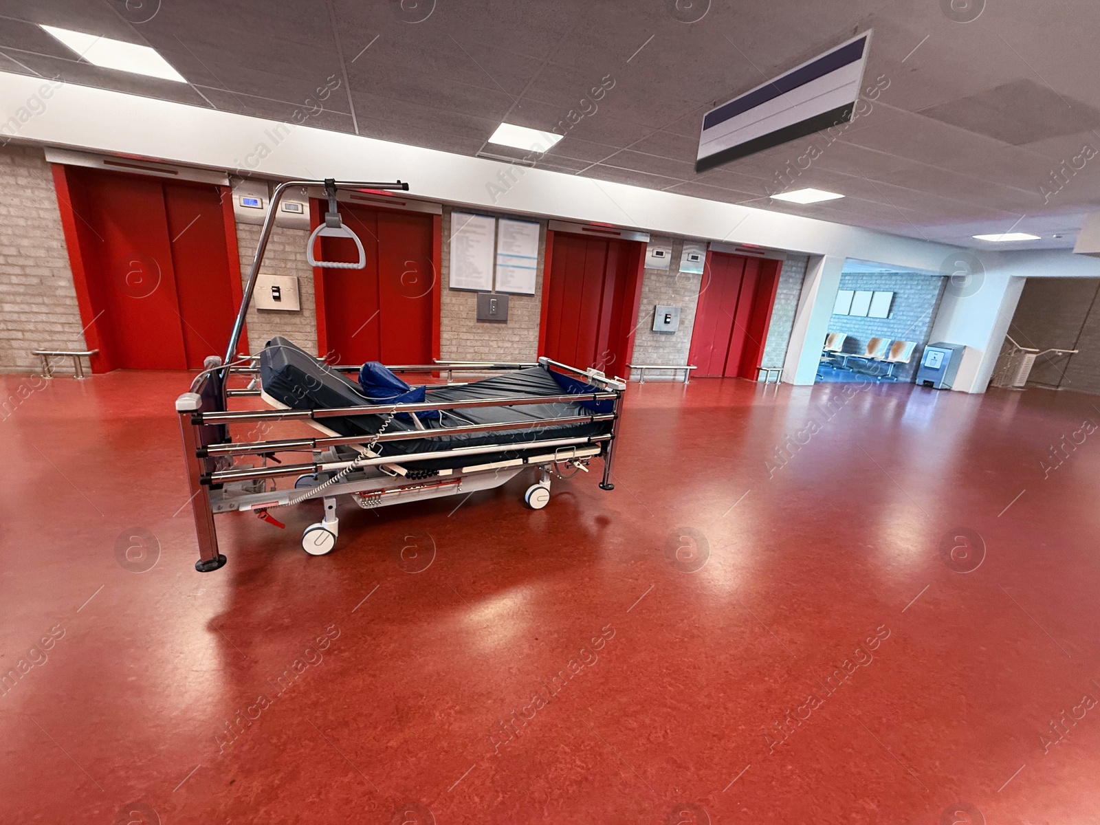 Stretcher inside modern hospital hall. Medical equipment Photo of Stretcher inside modern hospital hall. Medical equipment