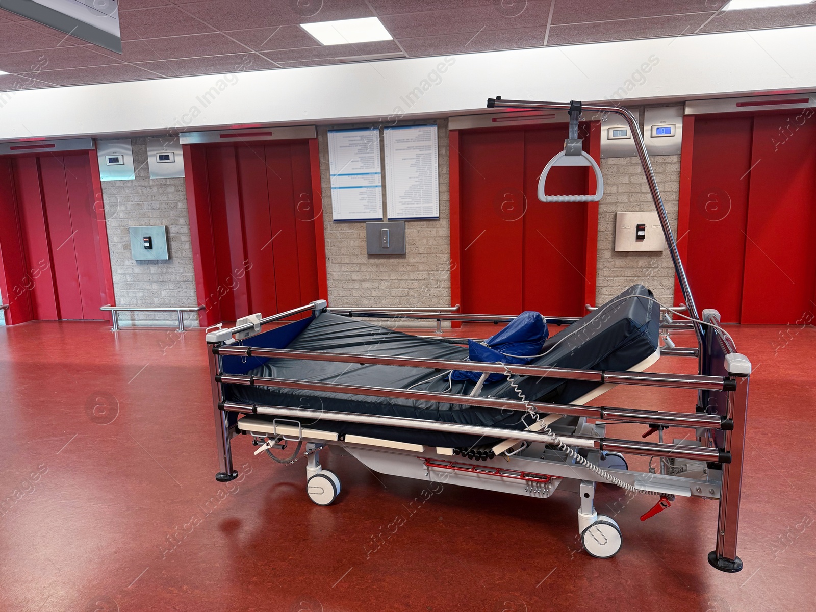 Stretcher inside modern hospital hall. Medical equipment Photo of Stretcher inside modern hospital hall. Medical equipment