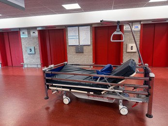 Photo of Stretcher inside modern hospital hall. Medical equipment