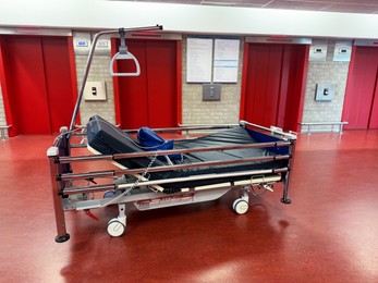 Photo of Stretcher inside modern hospital hall. Medical equipment