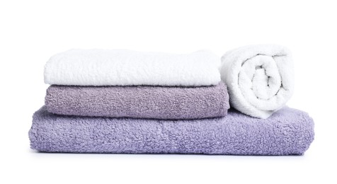 Photo of Many folded terry towels isolated on white