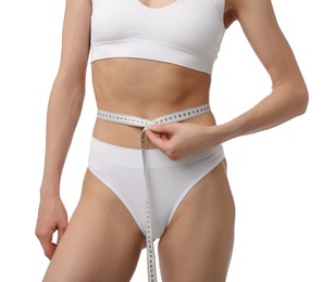 Photo of Woman with slim body and measuring tape on white background, closeup