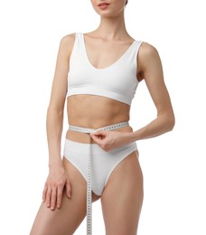 Photo of Woman with slim body and measuring tape on white background, closeup