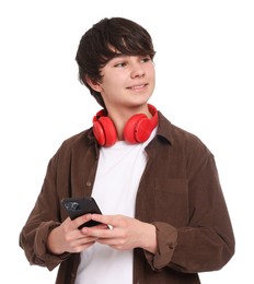 Photo of Teenage boy with headphones and smartphone on white background