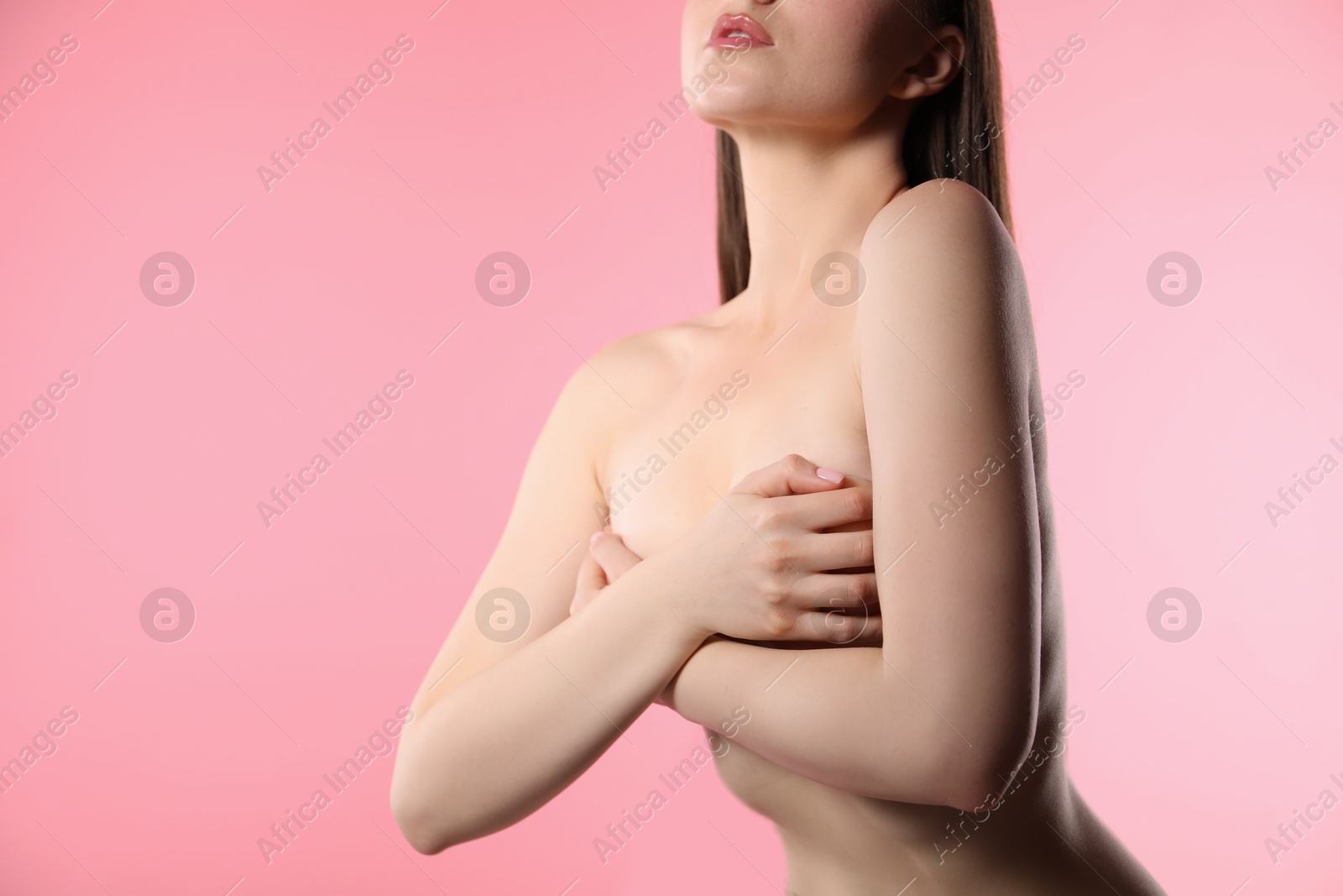 Woman with beautiful collarbones and breasts on pink background, closeup. Space for text Photo of Woman with beautiful collarbones and breasts on pink background, closeup. Space for text