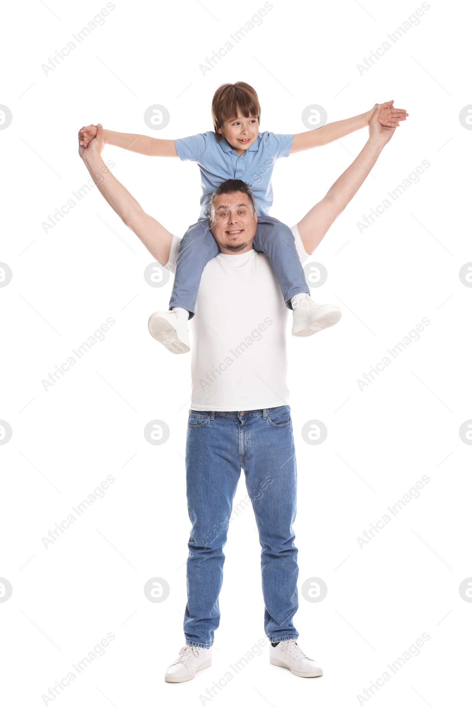 Father and his son having fun together on white background Photo of Father and his son having fun together on white background