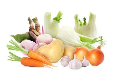 Image of Different root vegetables isolated on white. Onion, garlic and fennel bulbs, carrots, turnips, potatoes, horseradish roots