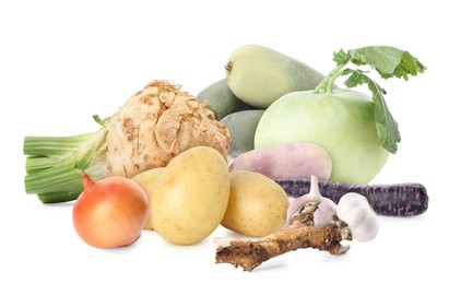 Image of Different root vegetables isolated on white. Onion, celery and horseradish roots, potatoes, garlic bulbs, carrot, daikon radishes, kohlrabi