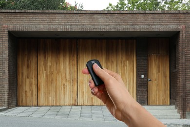Image of Woman using remote to control electric gate outdoors, closeup