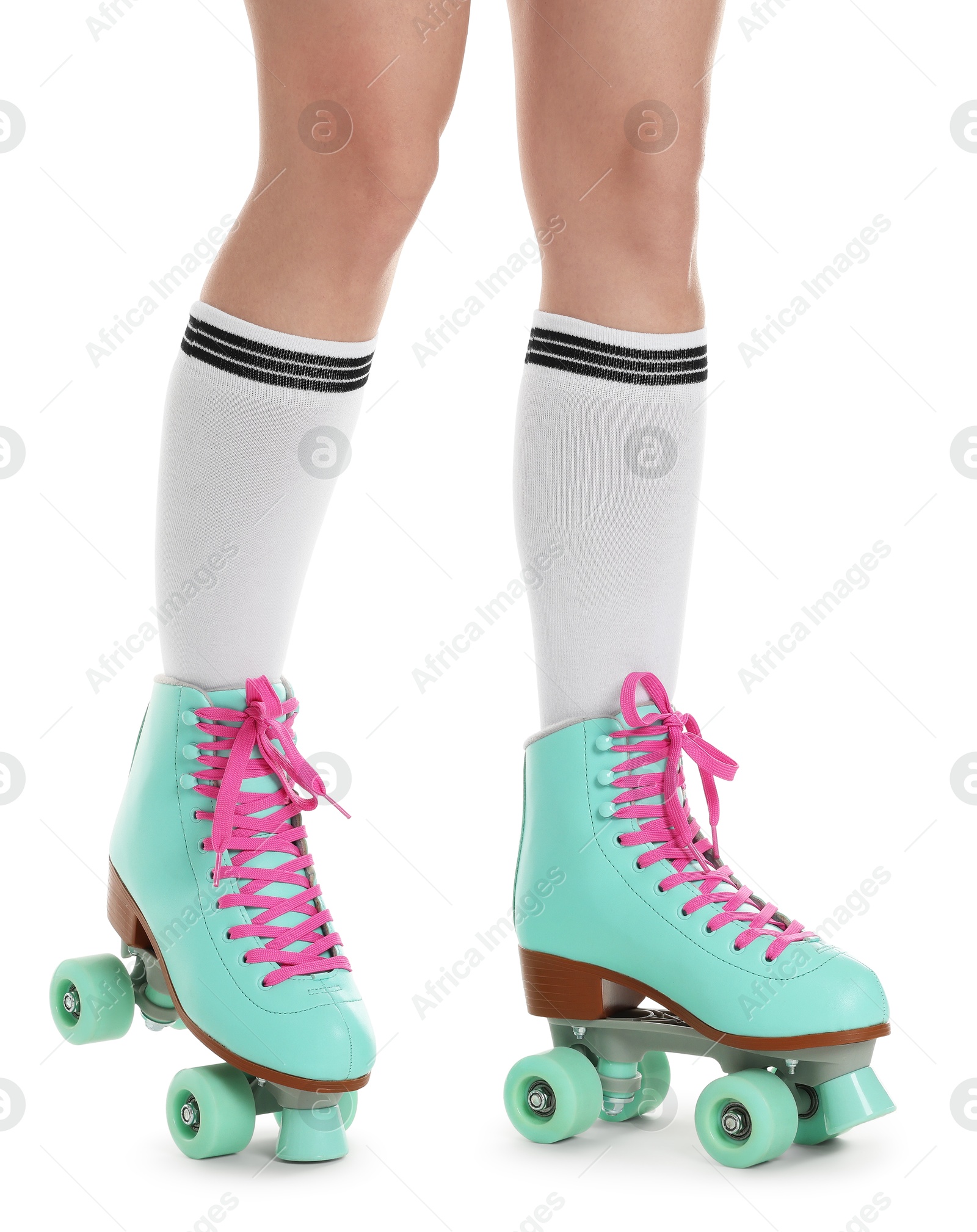 Woman in roller skates on white background, closeup Photo of Woman in roller skates on white background, closeup