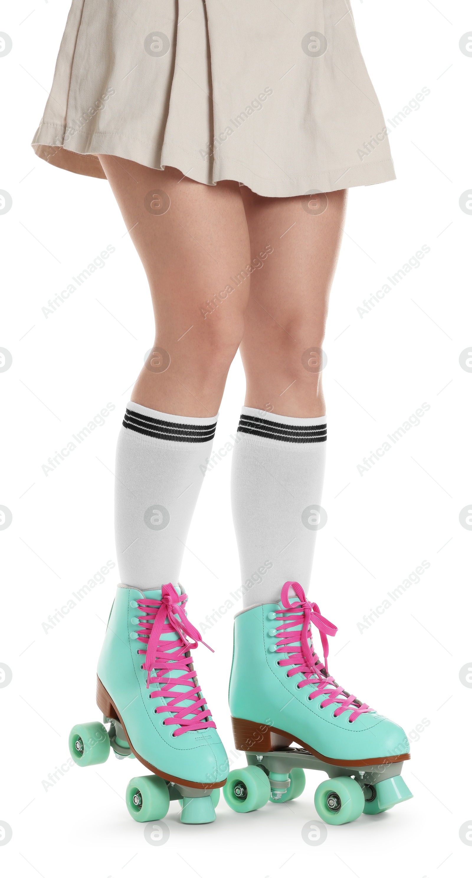 Woman in roller skates on white background, closeup Photo of Woman in roller skates on white background, closeup